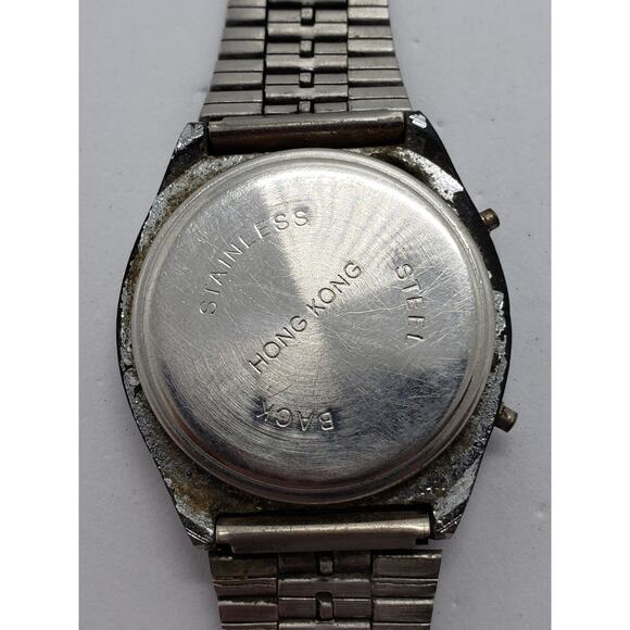 Women's silver digital watch. Quartz LCD